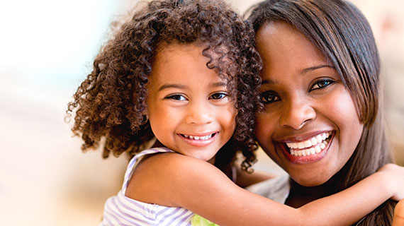 Smiling mom and daughter since they're lice free